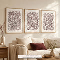 Garden Lines set of three paintings framed in a living room
