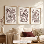 Garden Lines set of three paintings framed in a living room